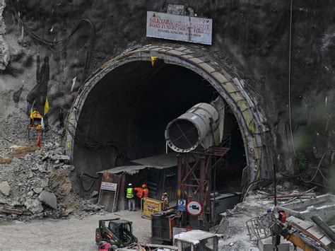 Rescuers use hand-held drills to free 41 workers trapped in an Indian road tunnel for over 2 weeks